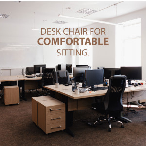 Office interior with desks, computers, and ergonomic chairs