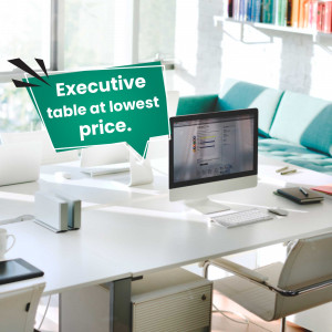 Modern office setup with a computer and promotional text