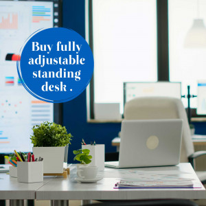 Image of a modern office setup featuring an adjustable standing desk with a laptop and office supplies.