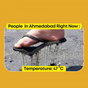 A foot pressing into melting asphalt on a hot day in Ahmedabad, India.