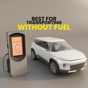 White electric car charging at a charging station