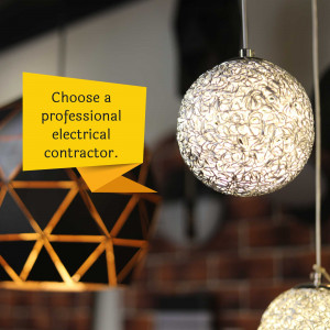 Modern lighting fixture with a text bubble promoting professional electrical services.