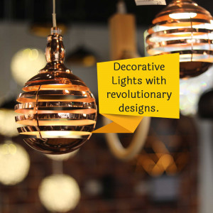 Close-up of modern copper-colored pendant lights with a yellow text overlay.