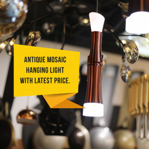 Close-up of an antique mosaic hanging light with a yellow price tag.