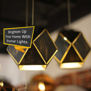 Close-up of decorative Jhummar lights with a promotional message.