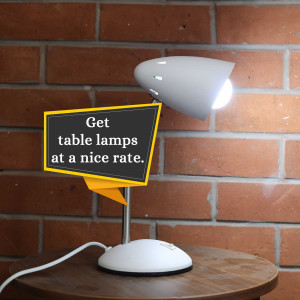 White table lamp with a chalkboard sign advertising table lamps