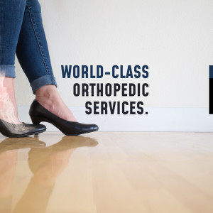 Woman in heels standing in front of text advertising orthopedic services