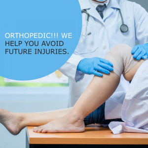 Doctor examining a patient's knee with a bandage