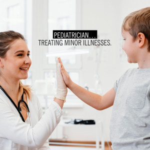 Doctor giving a high five to a child patient in a clinic