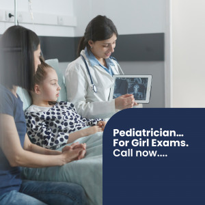 Doctor examining a young girl with her mother present, looking at an X-ray on a tablet.