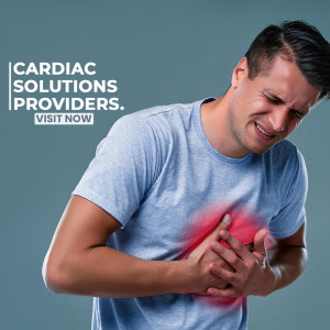 Man clutching his chest in pain, indicating a possible heart attack.