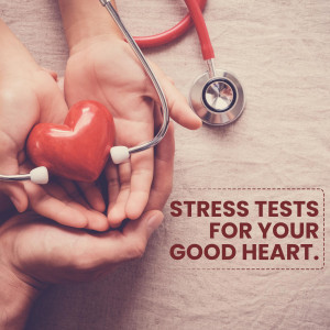 Hands holding a red heart with a stethoscope, representing heart health and medical testing.