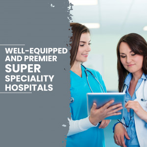 Two female doctors looking at a tablet in a hospital setting.