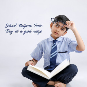 Young boy in school uniform reading a book