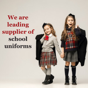 Two young girls in school uniforms holding hands, promoting a school uniform supplier.