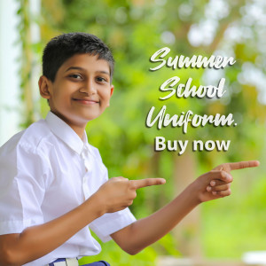 Young boy in school uniform pointing downwards with text 'Summer School Uniform. Buy now'