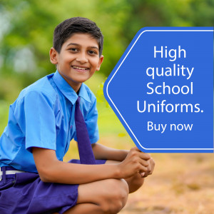 A young school boy in uniform smiling and holding a sign promoting school uniforms.
