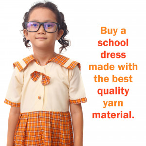 Young girl wearing a school dress with text promoting school dress purchase.