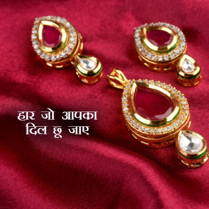 Close-up of a gold jewelry set with ruby gemstones