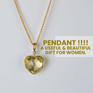 Close-up of a gold necklace with a heart-shaped yellow gemstone pendant.
