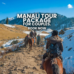 Couple on a horse ride in Manali with snow-capped mountains in the background