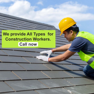 Construction worker installing roof tiles