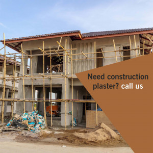 House under construction with scaffolding and a call to action for plastering services.