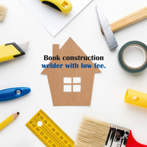 Construction tools and a paper house with text promoting affordable construction services.