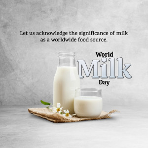 A glass bottle and a glass of milk with flowers on a burlap mat, celebrating World Milk Day.
