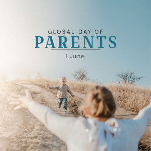 Image celebrating Global Day of Parents with a child running towards their parent.