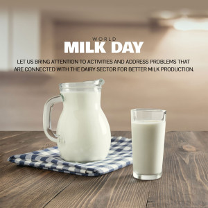 A glass pitcher and a glass of milk on a wooden surface with a checkered cloth, celebrating World Milk Day.