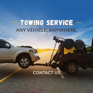 Towing truck assisting a damaged vehicle on a highway