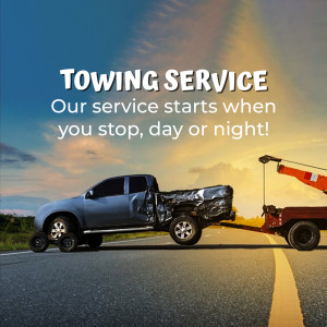 Towing truck assisting a damaged vehicle on a highway