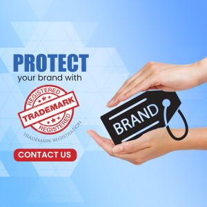 Hands holding a trademark tag with the word 'BRAND' on it, symbolizing brand protection.