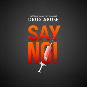 Image promoting awareness for the International Day Against Drug Abuse with the words 'Say No!' and a syringe.