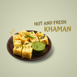 A plate of freshly made Khaman, a Gujarati snack, garnished with green chilies and served with green chutney.