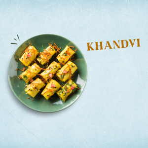 A plate of Khandvi, a traditional Gujarati snack.