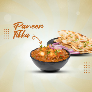 Close-up of Paneer Tikka with Naan and onions