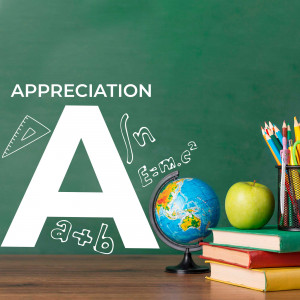 A chalkboard with the letter 'A', school supplies, a globe, and an apple.