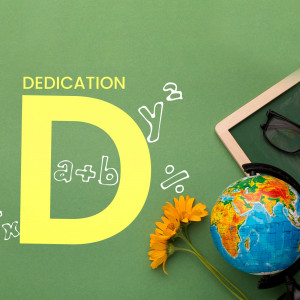 A chalkboard with the letter 'D' and school supplies