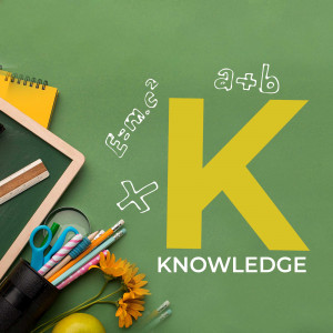 School supplies with the letter K and mathematical equations on a green chalkboard.