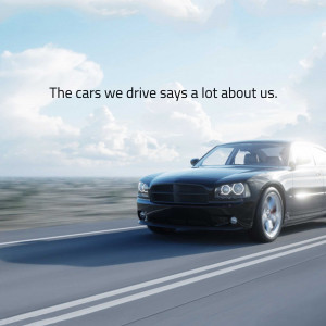 Black sedan driving on an open highway with text overlay