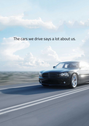 Black luxury car speeding on a highway with a blue sky background.