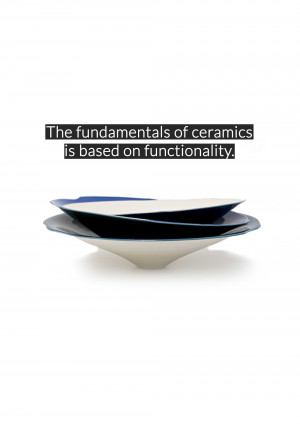 Stack of blue and white ceramic plates on a white surface