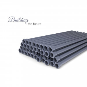 Stack of gray plastic pipes against a white background