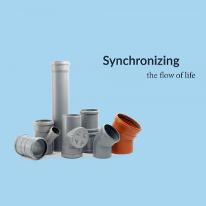 Assortment of gray and orange PVC pipe fittings against a light blue background.