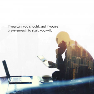 Silhouette of a person working on a laptop with a cityscape inside their head