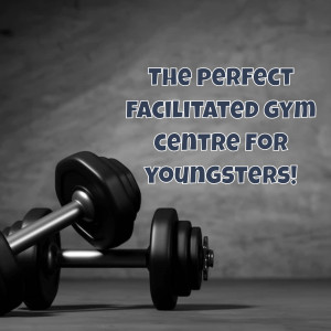 Dumbbells in a gym setting with text promoting a gym for youngsters