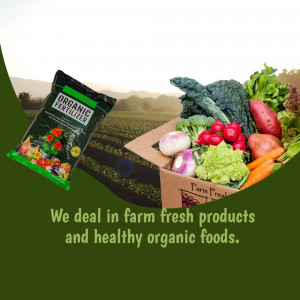 A box of fresh organic vegetables and a bag of organic fertilizer with a field in the background.