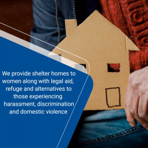 Cardboard house representing shelter with text about support for women